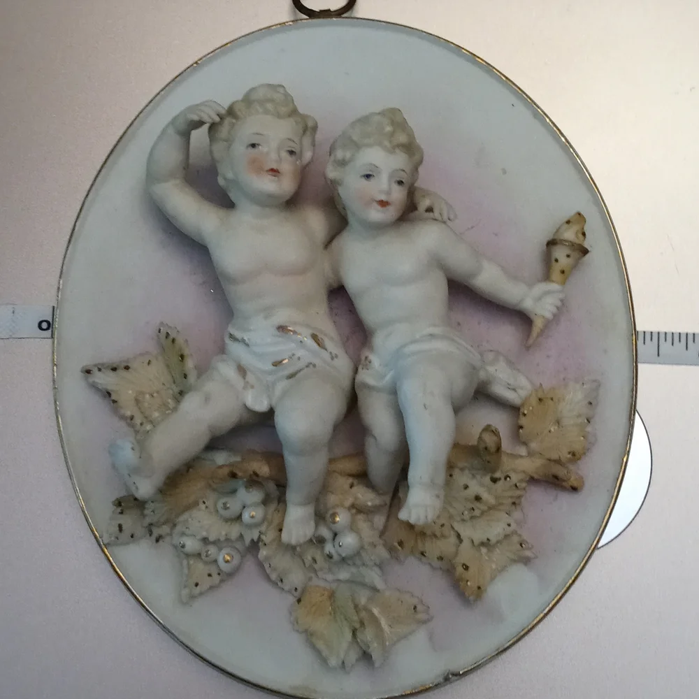 Antique cherub wall plaque